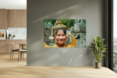 Smiling Cambodian dancer in traditional golden costume and crown Reproduction