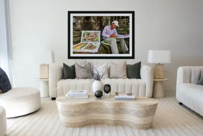 Artist drawing ancient temple carvings outdoors. Reproduction