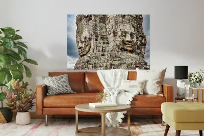 Ancient stone faces carved into Bayon Temple Cambodia. Reproduction