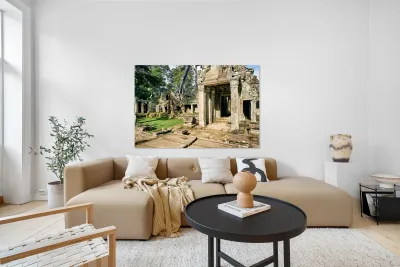 Ancient temple ruins overgrown by massive tree roots. Reproduction
