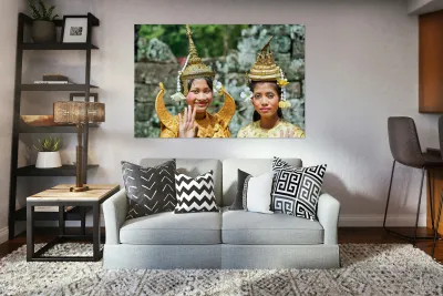 Cambodian dancers in golden attire and elaborate headwear. Reproduction