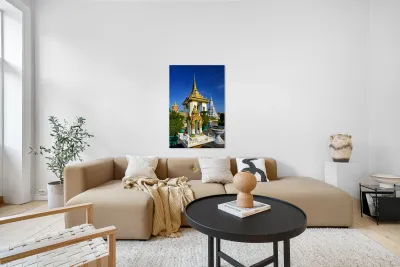 Golden temples and a grey stupa under a clear blue sky. Reproduction