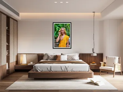 Smiling monk talks on phone with towel on head. Reproduction