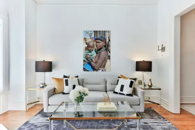 Portrait of young Zemba woman holding child in Kunene Region Reproduction