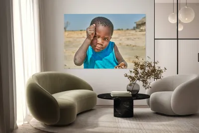 Joyful boy in Kavango Region playing in Namibia Reproduction