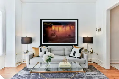 Niagara Falls illuminated orange at night. Reproduction