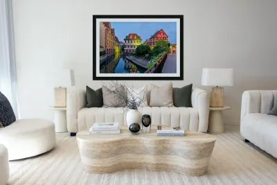 Timber framed houses and visitors in Colmar canals at dusk Reproduction