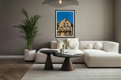 Timber framed houses in Colmar with clear blue sky above Reproduction