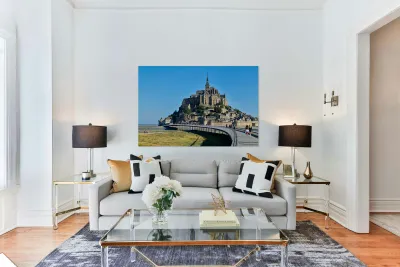 Tourists walking along the path to Mont Saint Michel in Normandy Reproduction