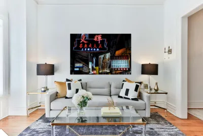 Neon signs light up a busy street in Hong Kong at night Reproduction