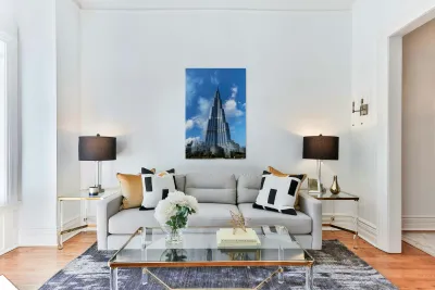 Burj Khalifa stands tall against a blue sky in Dubai UAE Reproduction