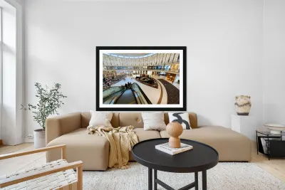 Busy shopping mall in Dubai with escalators and various stores Reproduction