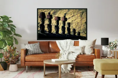 Easter Island Moai statues with red hats on a hillside. Reproduction