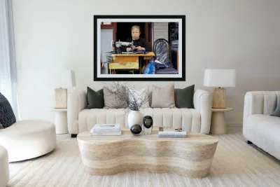 Elderly woman sews at machine in Shanghai China Reproduction