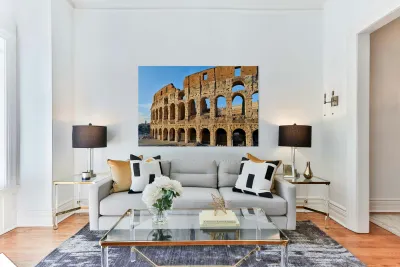 Colosseum stands tall in Rome during golden hour Reproduction
