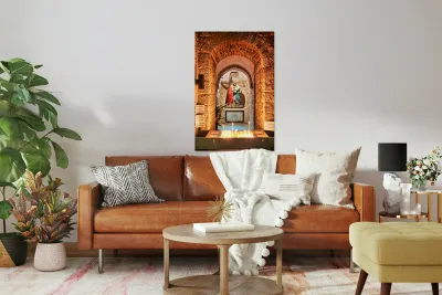Statue of Mary and Jesus in a chapel with candles Reproduction