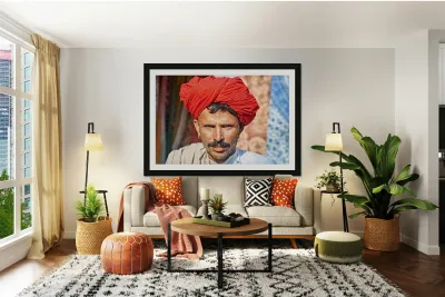 Man in red turban poses in Rajasthans Jaisalmer market street Reproduction