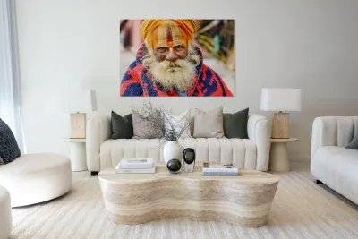 Old holy man in Varanasi wearing bright colors in Uttar Pradesh Reproduction