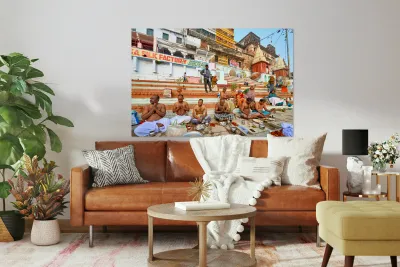 Barechested men offer prayers by the Ganges River in Varanasi Reproduction