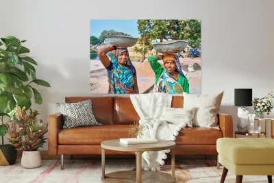 Women carry materials in Varanasi near the river bank Reproduction