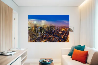 Aerial view shows Manhattan skyline at dusk with city lights Reproduction