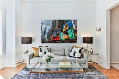 Crowd gathers in Times Square with bright ads in New York City Reproduction