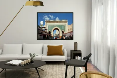 People walk through Bab Bou Jeloud a famous gate in Fez Morocc Reproduction