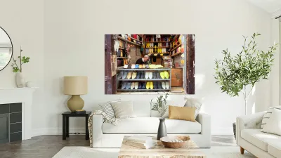 Moroccan babouches shoes in a Fez shop with a vendor Reproduction