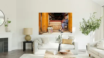 Old man in second hand shop at medina in Fez Morocco Reproduction