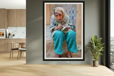 Beggar sitting in Fez Morocco with worn clothes and hands Reproduction