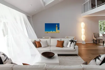 Mosque tower in Damascus against clear blue sky Reproduction