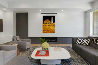 Aleppo mosque at night with lights and visitors in the courtyard Reproduction