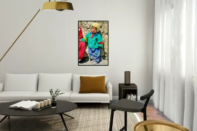 Indigenous child in colorful clothes and yellow hat outdoors. Reproduction