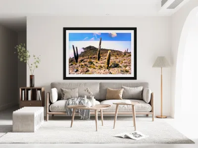 Cactus island in a vast white salt flat under blue sky. Reproduction