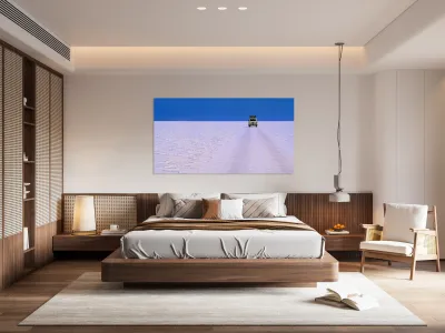 Van driving across vast white salt flat under blue sky. Reproduction