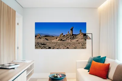 Arid desert with unusual rock pillars against a blue sky. Reproduction