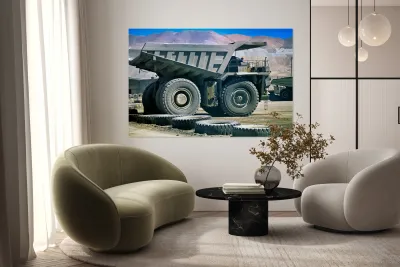 Giant mining dump truck in a dusty mountain quarry. Reproduction