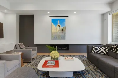 Visitors explore Sultan Qaboos Grand Mosque in Muscat Reproduction