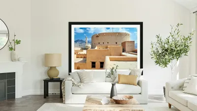 Visitors explore Nizwa Fort a historic site in Oman Reproduction