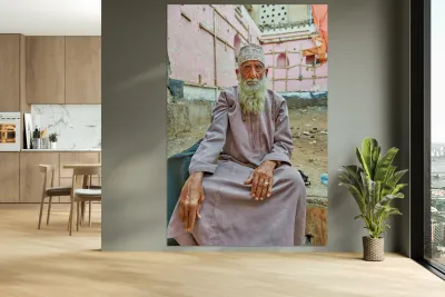 Old man sitting in a historical site in Muscat Oman Reproduction