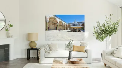 Visitors explore the courtyard at Fatih Mosque in Istanbul Reproduction
