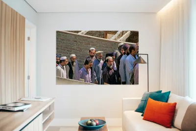 Men heading to work in Peshawar streets during morning hours Reproduction