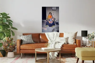 A woman holds her child in a Kalash village Reproduction
