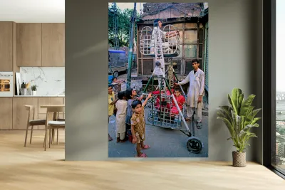 Children enjoy playtime on a swing in Lahore Reproduction