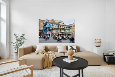 Busy street scene in Ho Chi Minh City with motorbikes and shops Reproduction